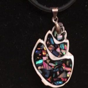 SYNTHETIC OPAL CHIPS IN A SEA SHELL